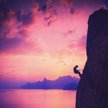 Climber against sunset. Vintage picture