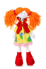 beautiful plush doll is dressed in beautiful dress on white isolated background