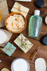close up of body care cosmetic products on wood