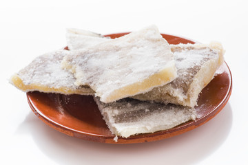 pieces of salted cod on clay plate