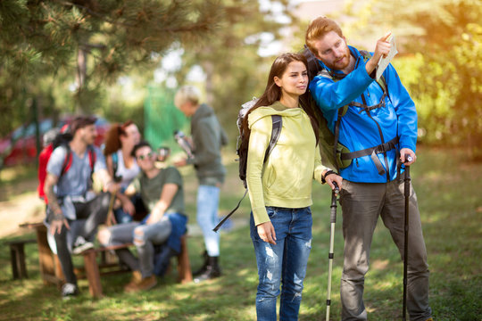 Male and female hiker in wood