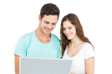 Happy couple using a laptop