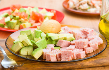 chopped avocado and diced cooked ham on plate