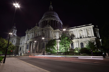 St Paul's cathedral illuminated at night in London, empty street
