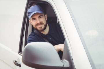 Delivery man sitting in his van © WavebreakmediaMicro