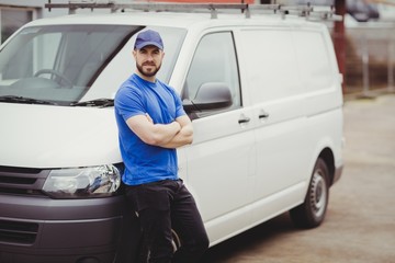 Man leaning against his van
