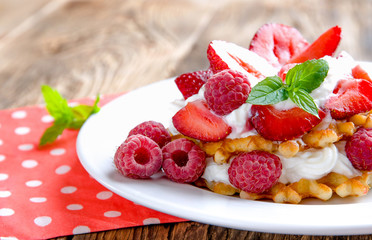 Waffles with strawberries and raspberries.
