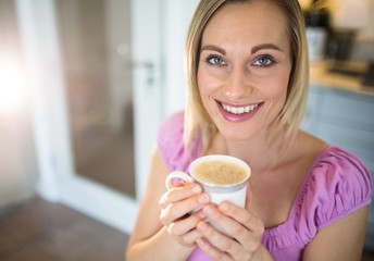 Pretty blonde woman having coffee