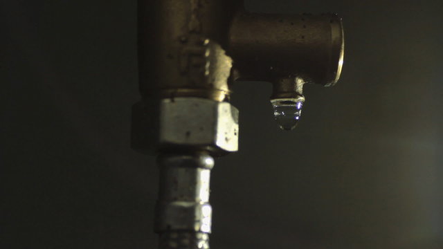 Drop Drips From a Pipe Tube