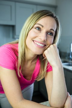 Pretty Blonde Woman Leaning On The Counter