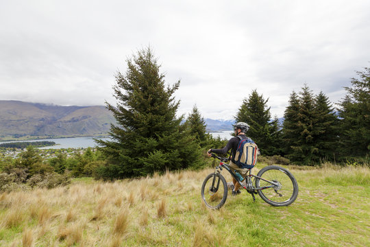 Mountain Bike Rider At Lake Wanaka, New Zealand