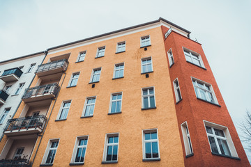Fototapeta na wymiar Box type folding windows on brick apartments