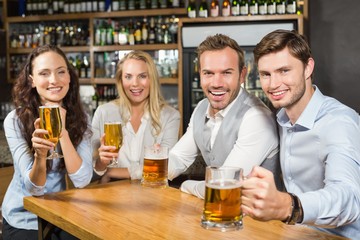 Friends toasting with beers