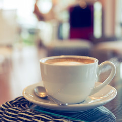 coffee cup on table with blur interior cafe coffee shop