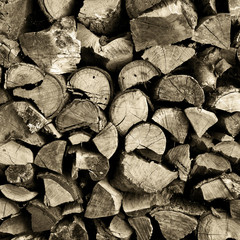 Stack of chopped and split firewood logs arranged.