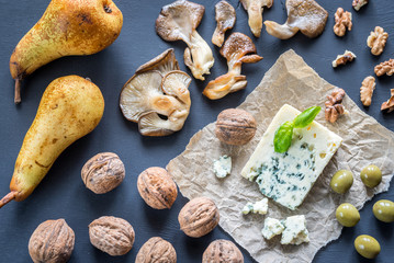 Blue cheese with walnuts, oyster mushrooms and green olives