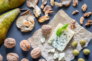 Blue cheese with walnuts, oyster mushrooms and green olives