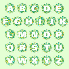 Alphabet letters in a circle of oak leaves and acorns.