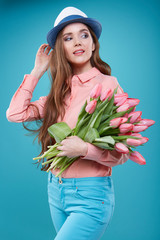 Young beautiful woman studio portrait with tulip flowers
