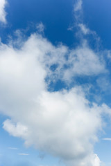 fluffy cloud above blue sky background
