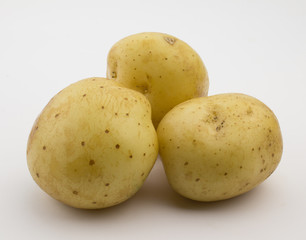 Photo of three potatoes isolated on white background