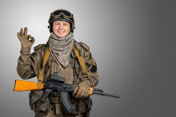 Happy military man gesturing OK sign