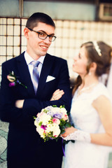 cute young gentle stylish bride and groom on the background  aba