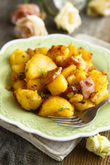 Fried potatoes with pork and onion