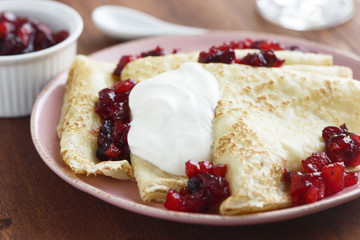 Buttermilk pancakes with berries and cream