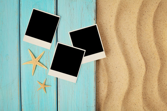 Summer empty polaroid photo card on a sea sand. summer background