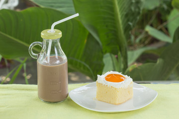 Cake with Orange jam and Chocolate milk