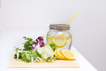green leaves, lemon and water,