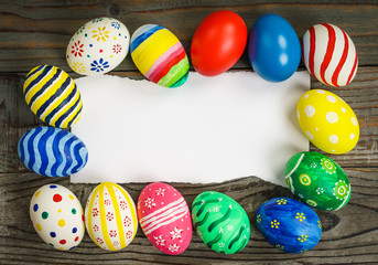 Easter eggs gift card on wooden background