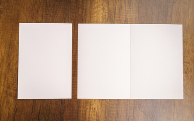 Bifold white template paper on wood texture