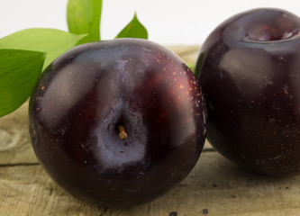 Plums on wood