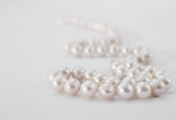  Pearl necklace on white background