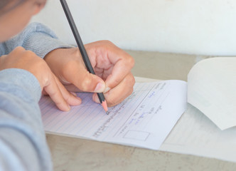 Blurred of Thai student writing a test in exercise, Exams.