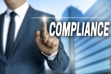 compliance touchscreen is operated by businessman