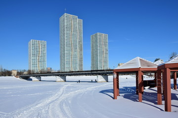 Obraz premium Street view in Astana, Kazakhstan, in winter, with residential towers called GRAND ALATAU