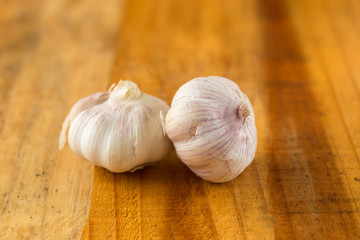 Garlic on wood background