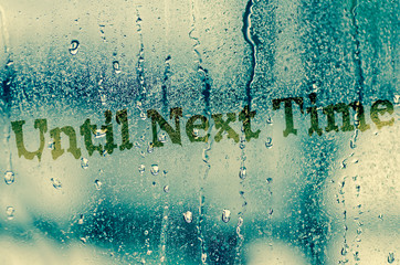 natural water drops on glass window with word 