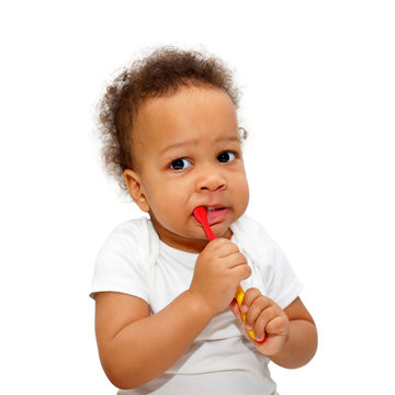 Black baby toddler brushing teeth.