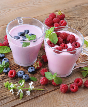 Yogurt with raspberries and blueberries.Concept for healthy eating.