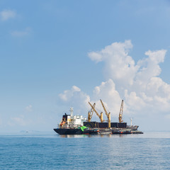 Cargo ship sailing in ocean