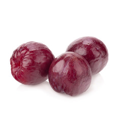 plums isolated on white