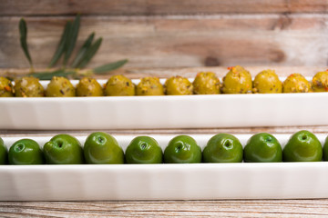 White boards with giant  green olives with leaves