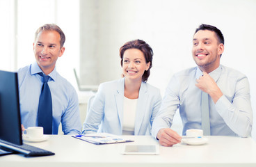 business team discussing something in office