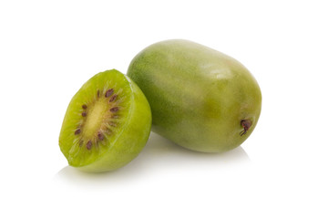 Kiwi berries and a cut one on a white background