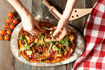 Home made pizza on wooden table