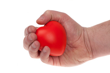 Hand holding and taking care of a red heart. isolated white background